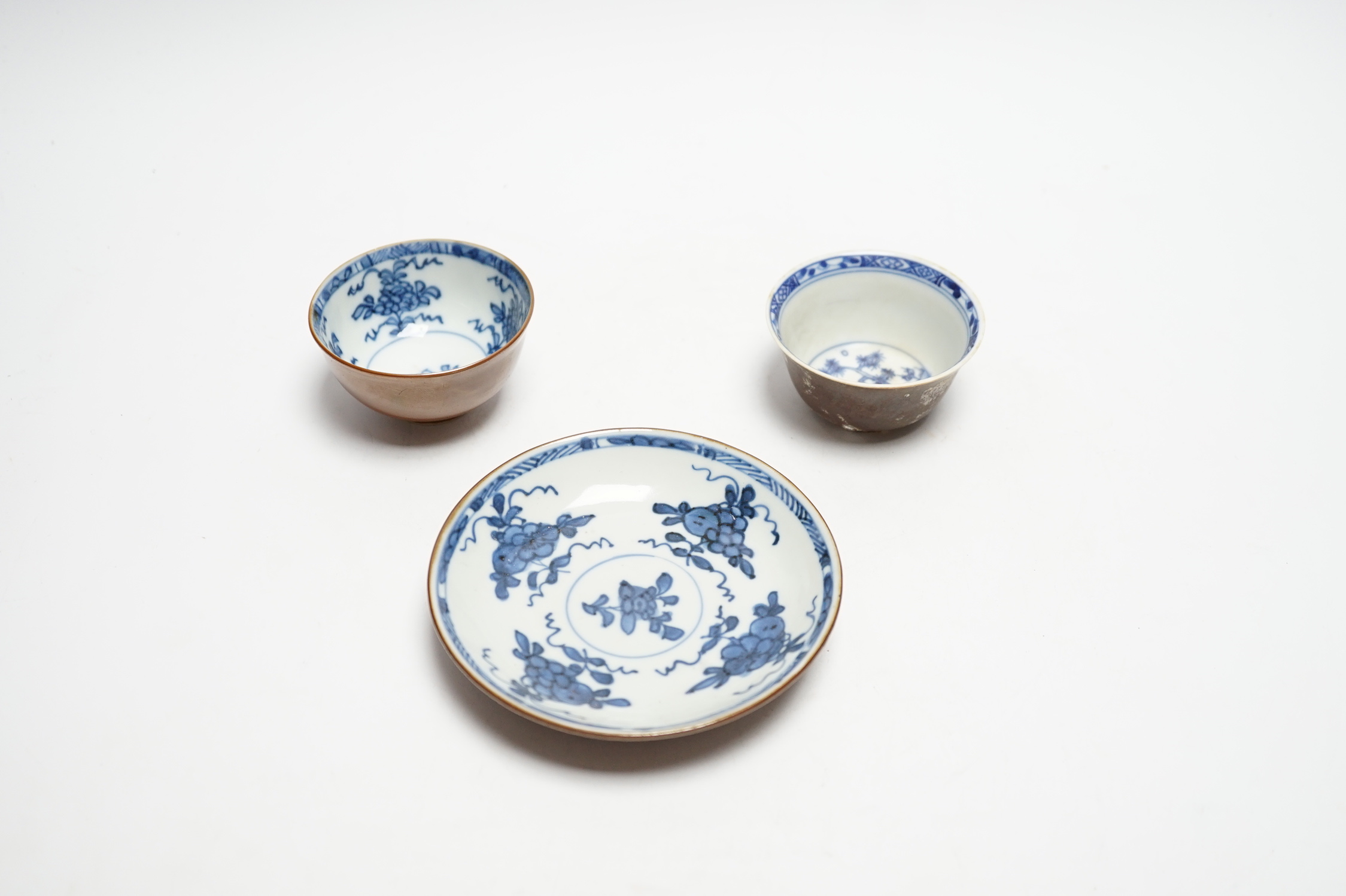 A Chinese Nanking cargo type tea bowl, another tea bowl and saucer, Qianlong period